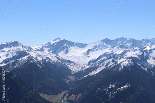 Landscape of snowy Alp mountains with forests  taken from Alpspitz peak in Gaflei village in the municipality of Triesenberg in Principality of Liechtenstein.
