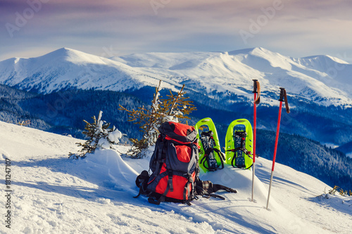 Obraz na plátně red backpack and snowshoe (snowcats)
