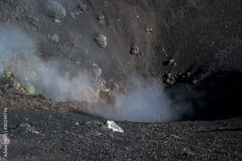 steam and toxic gases emanating from the Etna volcano crater in Sicily