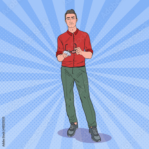 Pop Art Young Man Cleaning his Eyeglasses with Rag. Vector illustration