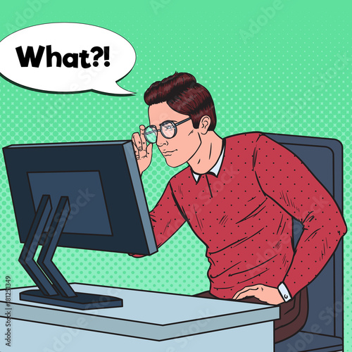 Pop Art Weak-Eyed Young Man in Eyeglasses Working at the Computer. Vector illustration