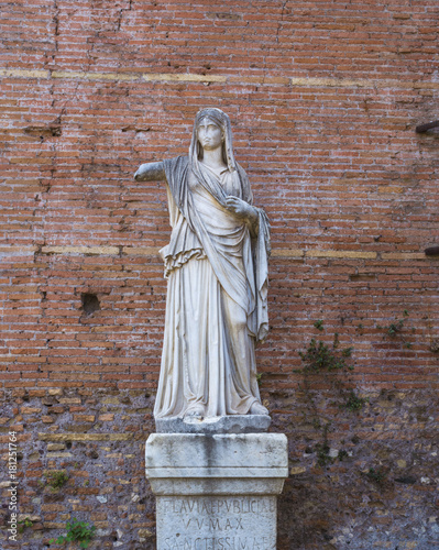 Roman statue at House of the Vestals in Roman Forum , Rome, Italy. photo