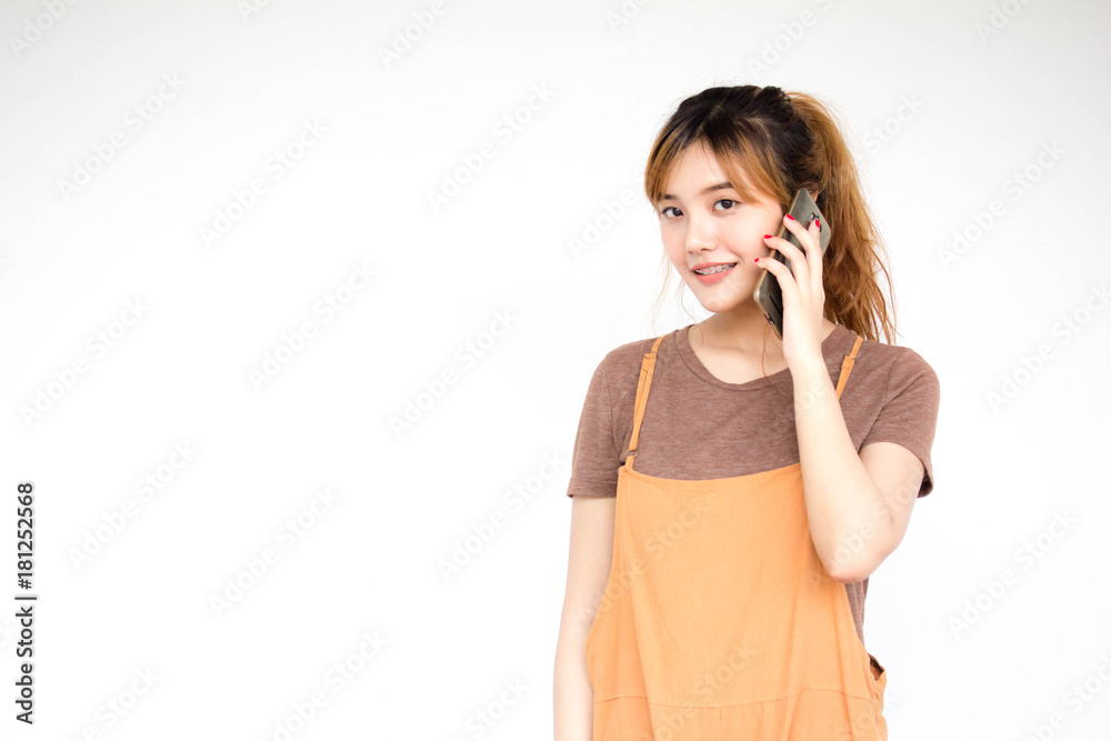 Beautiful young adult thai chinese bronze hair calling smart phone Beautiful young adult thai chinese bronze hair calling smart phone