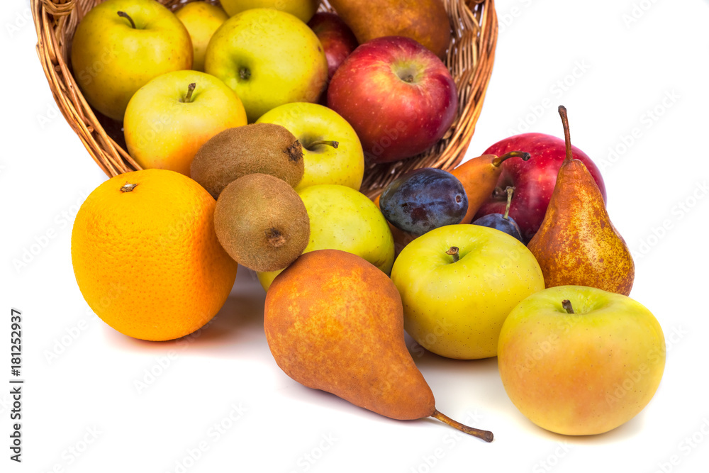 apples and other fruits in a wicker basket on a white background. apples and other fruits in a wicker basket on a white background.