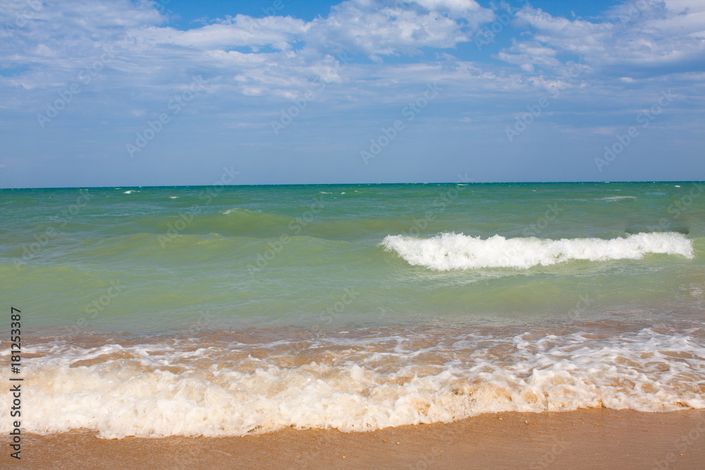 Adriatic Sea coast view. Seashore of Italy, summer sandy beach with clouds on horizon. Adriatic Sea coast view. Seashore of Italy, summer sandy beach with clouds on horizon.