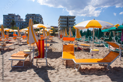 Wallpaper Mural Adriatic Sea coast view. Seashore of Italy, summer umbrellas on sandy beach with clouds on horizon. Torontodigital.ca