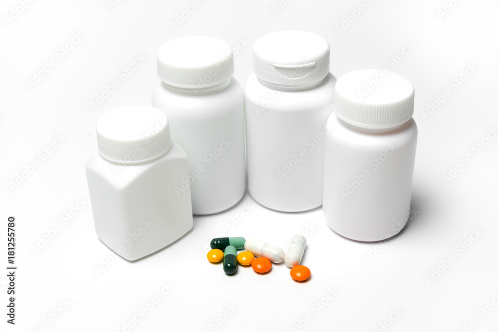 Medicine bottle and medicine on a white background Medicine bottle and medicine on a white background