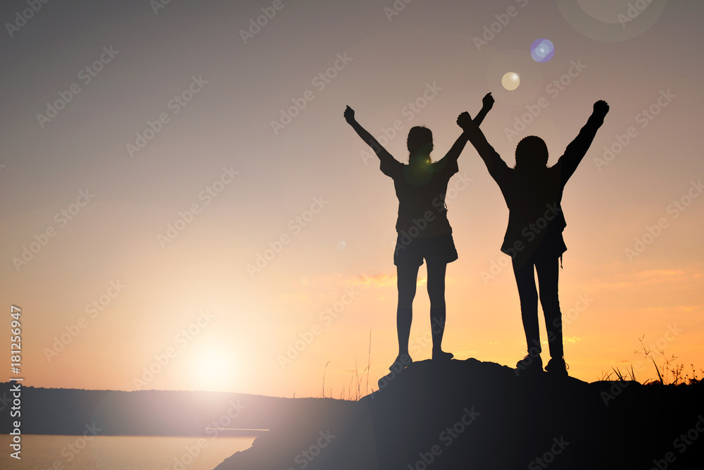 Silhouette women and girl backpacker on the top mountain , Relax time travel on holiday Silhouette women and girl backpacker on the top mountain , Relax time travel on holiday