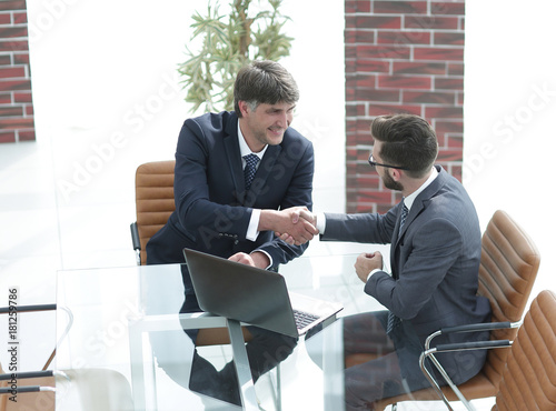 hands shake between two successful business people