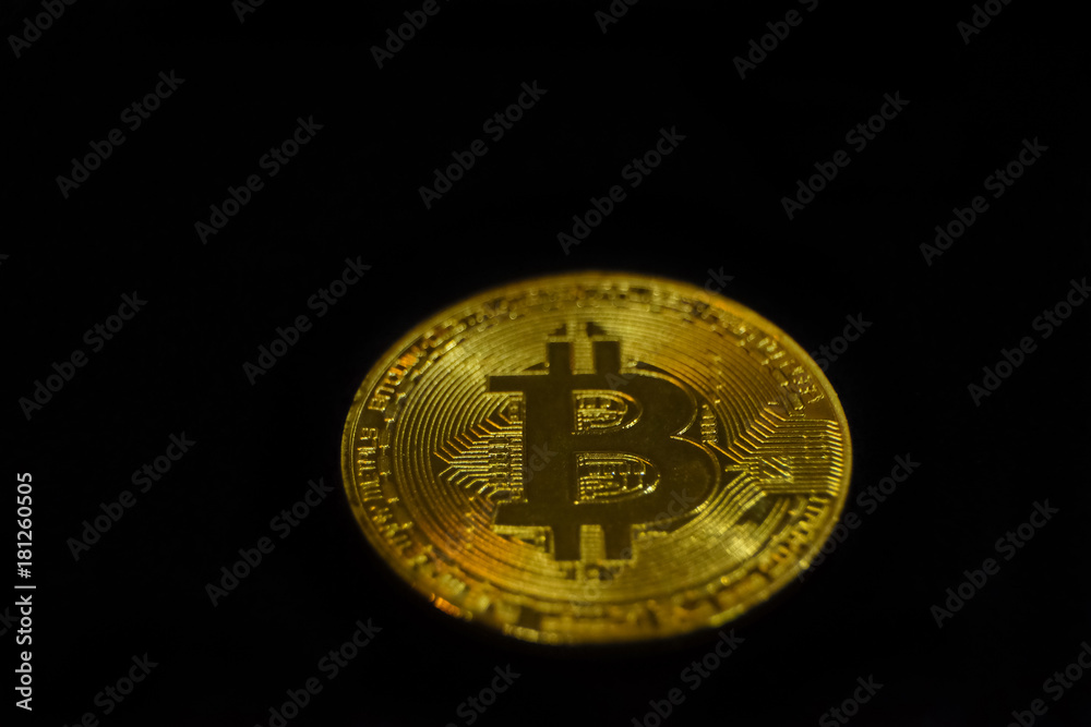 Golden bitcoin on black background Golden bitcoin on black background