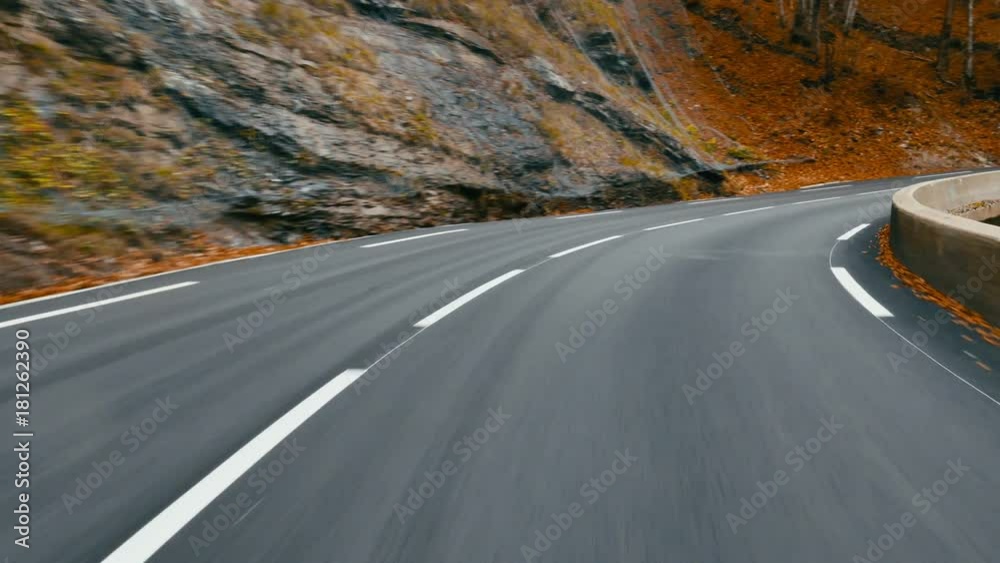 POV DRIVING PLATE Car driving on a forest road in the mountains, no other cars. 4K UHD
