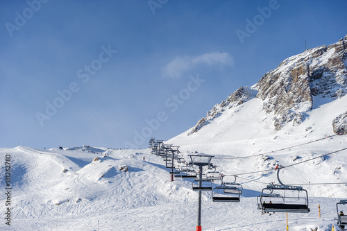 Ski lift in mountains at winter