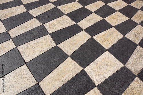 Outdoor street tiles with geometric pattern.The texture of perspective colored checkered tile in the street.