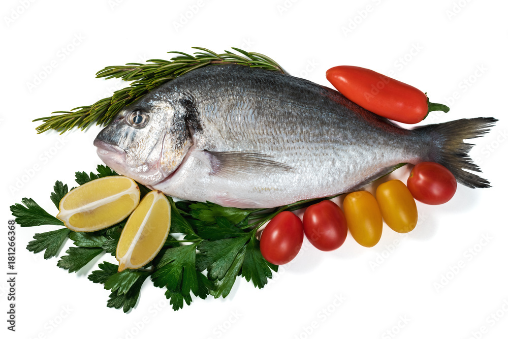 Raw fresh dorado fish with vegetables. Healthy food. Isolated on white background. Raw fresh dorado fish with vegetables. Healthy food. Isolated on white background.