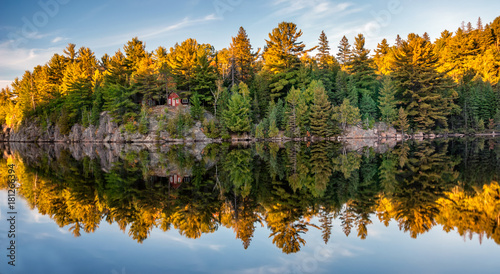 Autumn fall colours reflecting in lake photo