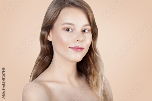 Young beautiful girl with clean perfect skin close-up