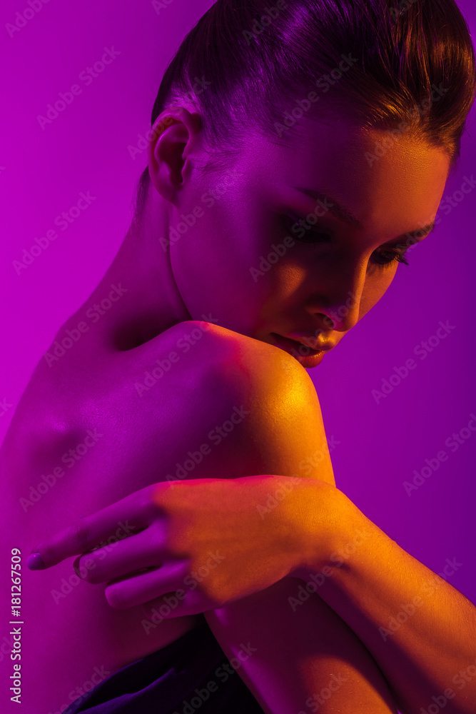 Young beautiful girl with neon lighting Young beautiful girl with neon lighting