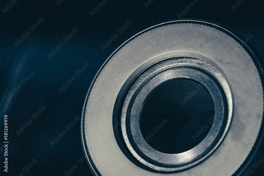 Metal shaft on a dark background close-up. Metal shaft on a dark background close-up.
