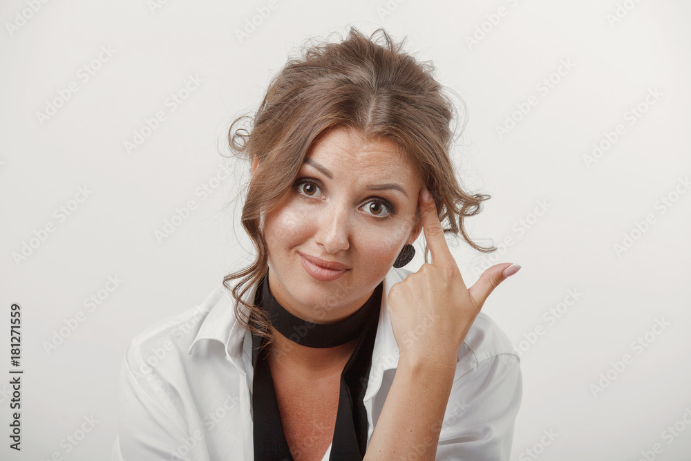 Young woman, beautiful hair, makeup, men's white shirt on a white background Young woman, beautiful hair, makeup, men's white shirt on a white background