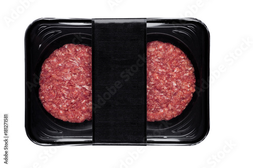 Raw fresh beef burgers in plastic tray
