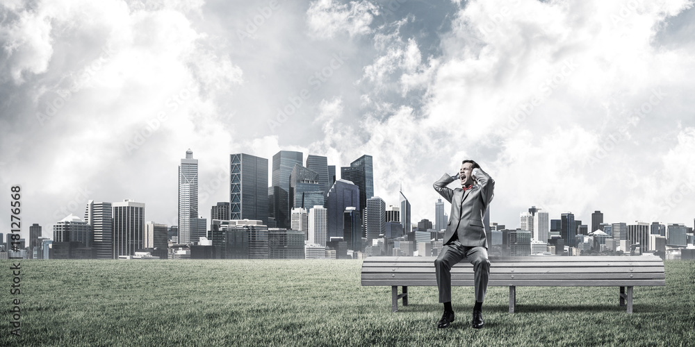 Young man in suit in park dont want to hear anything Young man in suit in park dont want to hear anything