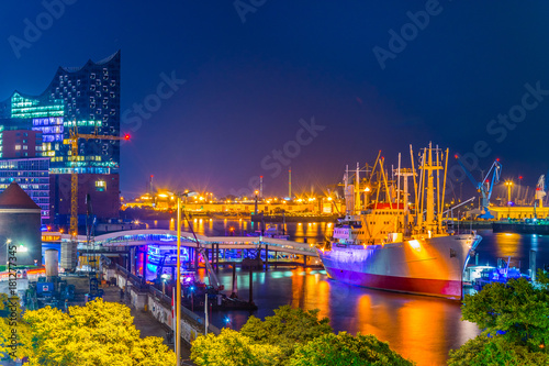 Night view of the port of hamburg with the elbphilharmonie building, Germany. photo