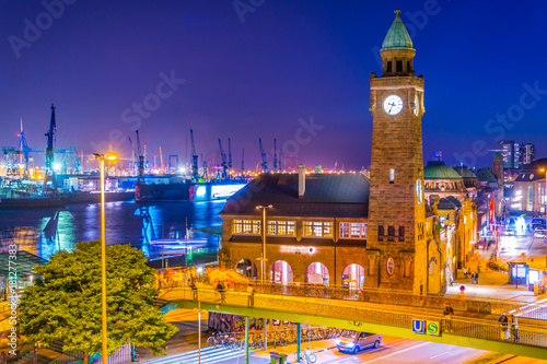 View of the hamburger landungsbruecken building in Germany during night. photo