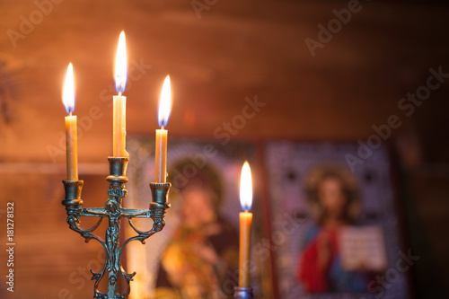 burning candle in a dark room, orthodox