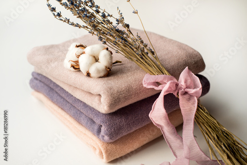 Home interior, tailor sewing, diy concept. Heap of colorful cloth fabrics. Color Cotton linen clothes. photo