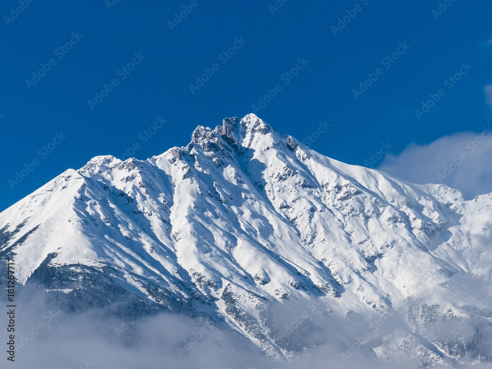 Snow covered mountain tops in the Tyrolean Alps Austria.