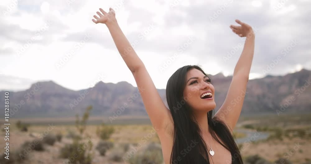 Female putting arms in air, exited and carefree Female putting arms in air, exited and carefree
