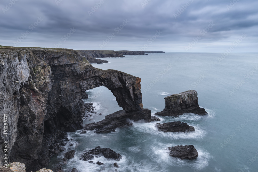 Beautiful landscape image of Green Bridge of Wales on Pembrokeshire Coast in Wales