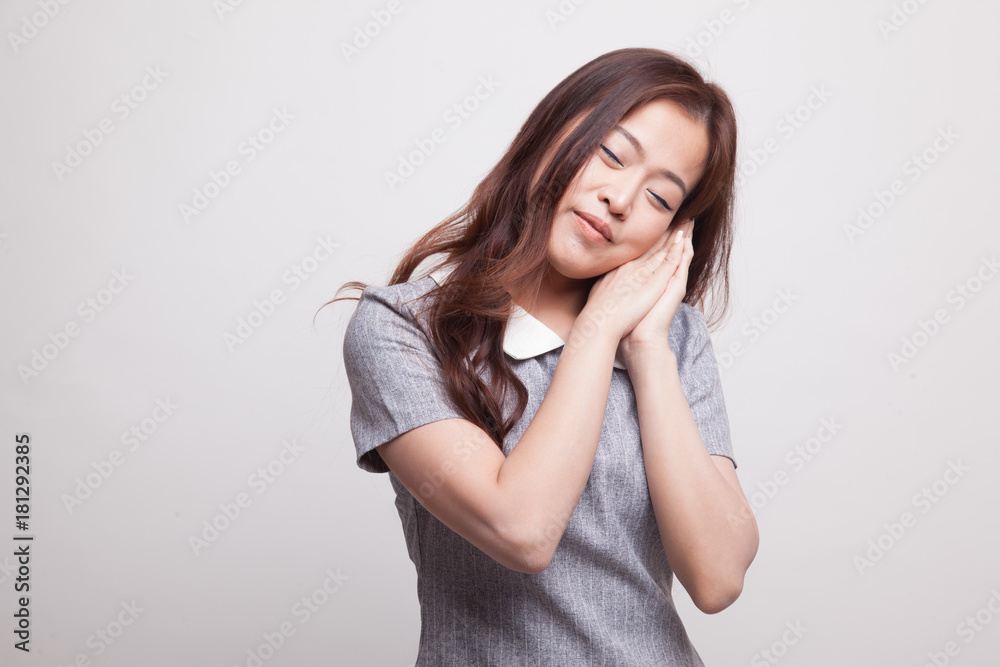 Beautiful young Asian woman with sleeping gesture. Beautiful young Asian woman with sleeping gesture.