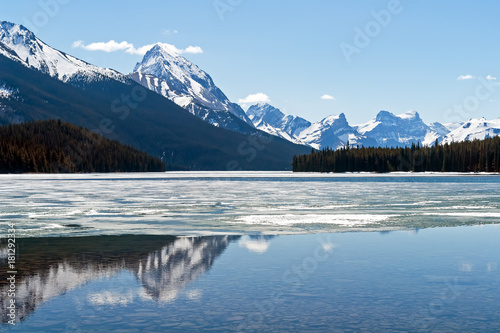 Rocky mountains reflecting in Maligne lake - Jasper national park, Canada