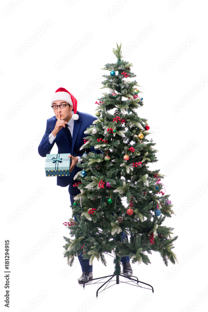 Businessman decorating christmas tree isolated on white Businessman decorating christmas tree isolated on white
