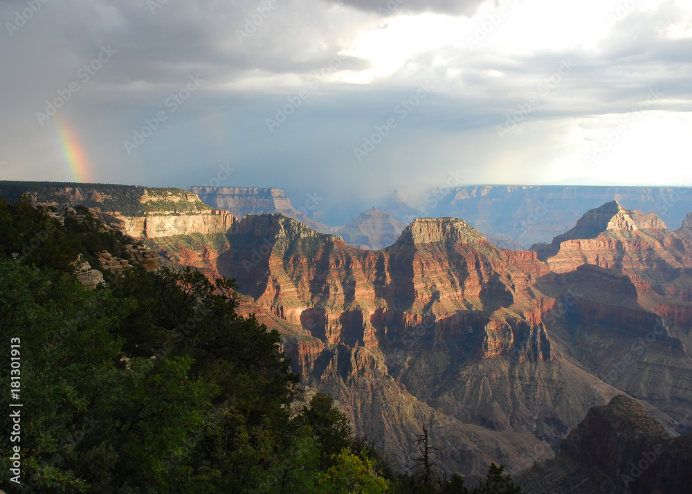 Rainbow during a thunderstorm at sunset at the North Rim of Grand Canyon National Park, Arizona