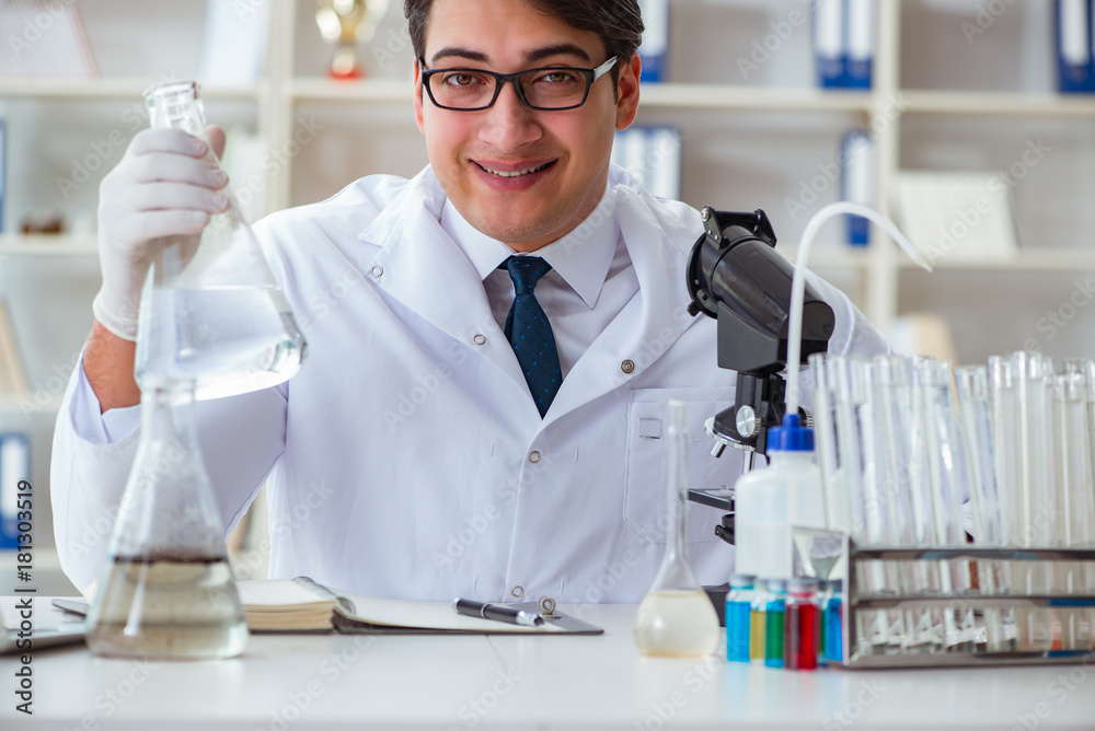 Young researcher scientist doing a water test contamination expe Young researcher scientist doing a water test contamination expe