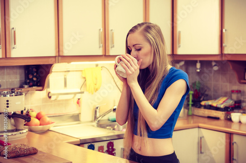 Woman holding cup of tea of coffee