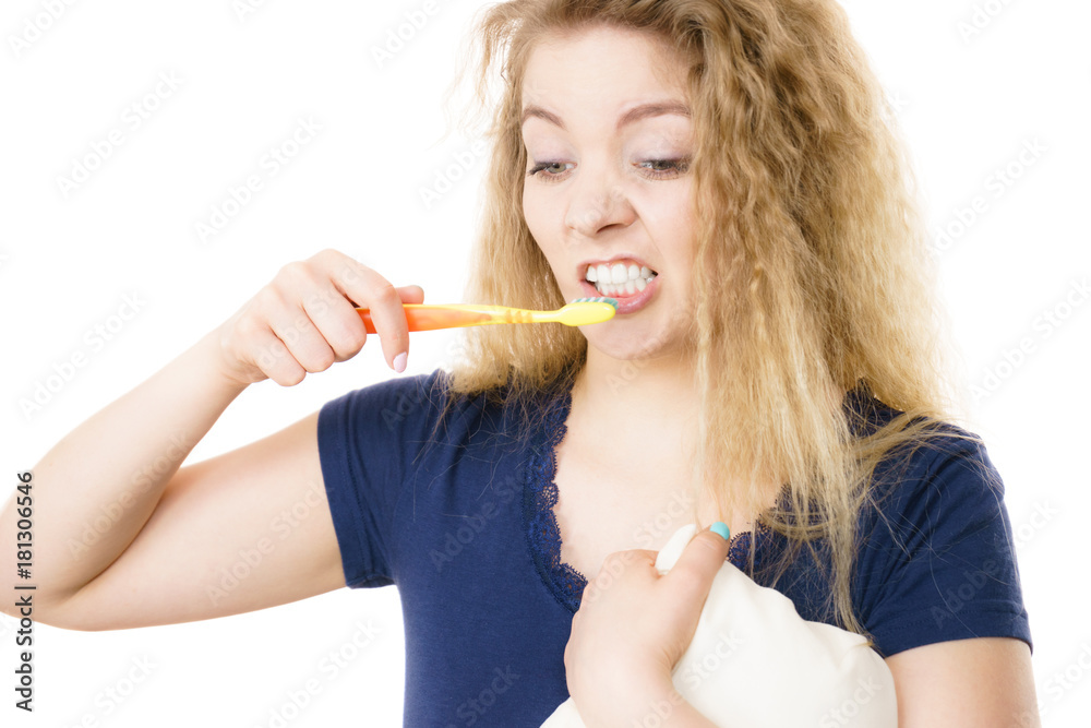 Grumpy tired woman brushing teeth, isolated Grumpy tired woman brushing teeth, isolated