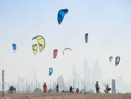Kite surf kites flying over Jumeirah public beach in Dubai, UAE.