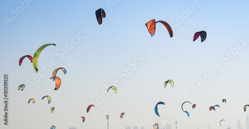 Kite surf kites flying over Jumeirah public beach in Dubai, UAE.