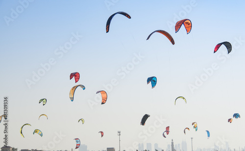 Kite surf kites flying over Jumeirah public beach in Dubai, UAE.