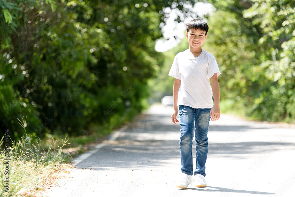Boy walk on the road Boy walk on the road