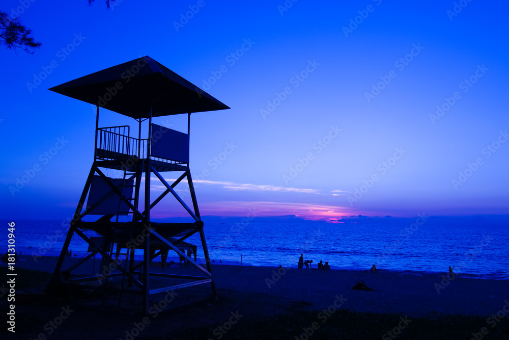 Security guard tower on the beach during sunset at Phuket Thailand Security guard tower on the beach during sunset at Phuket Thailand