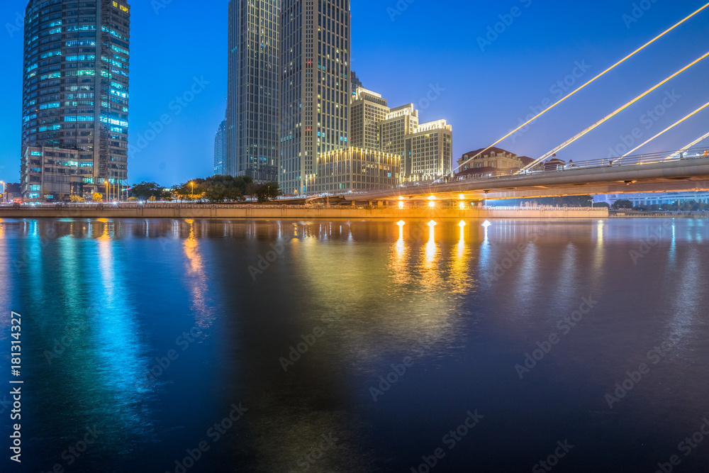 Tianjin Hai river waterfront downtown skyline with modern bridge
