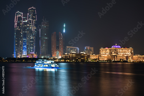 Abu Dhabi buildings skyline from the sea at night © dvoevnore