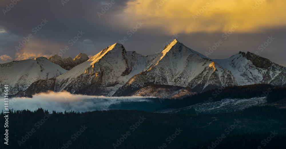 mountain panorama (Tatra Mountains) with multicolored, dramatic sky