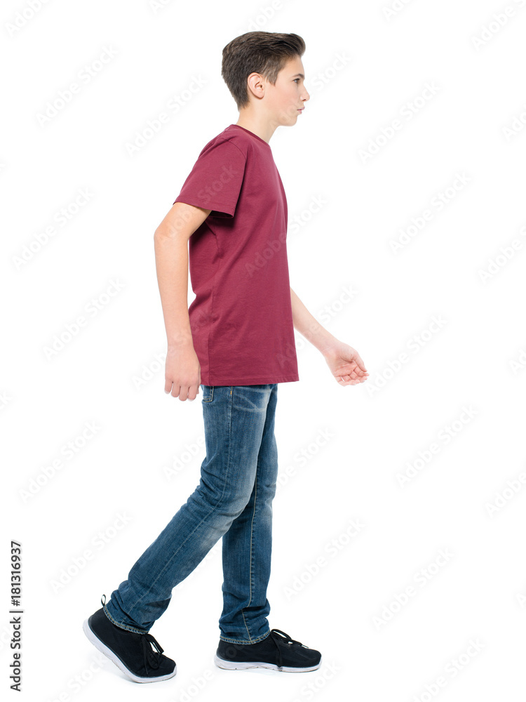 teen boy walking posing at studio Stock Photo Adobe Stock
