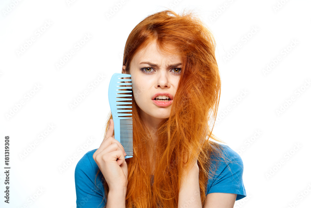 Beautiful young woman on white isolated background, comb, hairstyle Beautiful young woman on white isolated background, comb, hairstyle