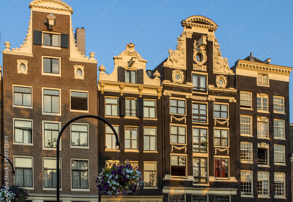 Fototapeta premium Traditional old buildings in Amsterdam